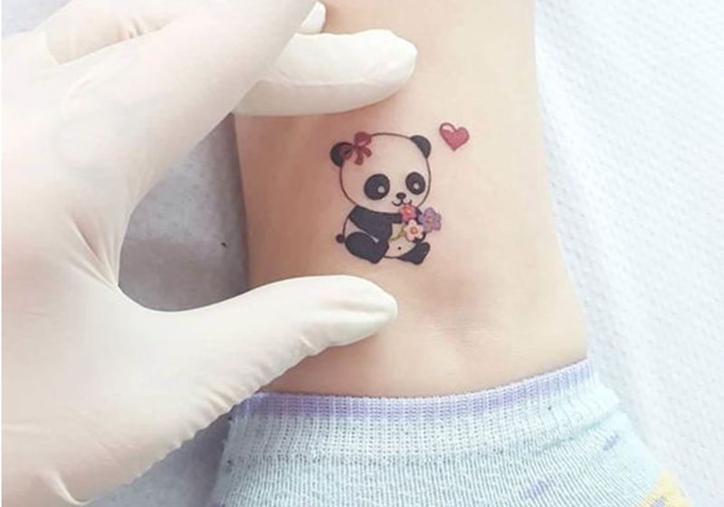 tatuagem feminina de panda